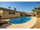 Rear view of home showcasing the pool and patio area at 4028 W Palo Verde Dr, Phoenix, AZ 85019