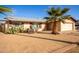 Single story home with desert landscaping and a two-car garage at 4028 W Palo Verde Dr, Phoenix, AZ 85019