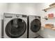 Laundry room with LG washer and dryer and shelving at 4028 W Palo Verde Dr, Phoenix, AZ 85019