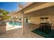 Covered patio with dining table and built-in BBQ grill at 4028 W Palo Verde Dr, Phoenix, AZ 85019