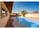 Inviting kidney-shaped pool with a covered patio area at 4028 W Palo Verde Dr, Phoenix, AZ 85019