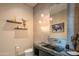 Stylish powder room with a unique vanity and modern fixtures at 41104 N 96Th St, Scottsdale, AZ 85262