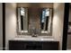 Double vanity bathroom with modern lighting and spacious counters at 41104 N 96Th St, Scottsdale, AZ 85262