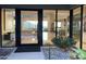 Modern entryway with glass doors, offering views of the living area at 41104 N 96Th St, Scottsdale, AZ 85262