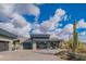 Contemporary home with clean lines, attached garage, and desert landscaping at 41104 N 96Th St, Scottsdale, AZ 85262