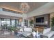 Elegant living room with fireplace and large windows at 41104 N 96Th St, Scottsdale, AZ 85262