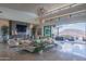 Modern living room with fireplace, large windows, and patio access at 41104 N 96Th St, Scottsdale, AZ 85262