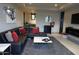 Elegant living room featuring a sectional sofa and a large TV at 41104 N 96Th St, Scottsdale, AZ 85262