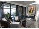 Elegant living room with modern furniture and large windows at 41104 N 96Th St, Scottsdale, AZ 85262