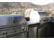 Luxury outdoor kitchen with Lynx grills and pizza oven at 41104 N 96Th St, Scottsdale, AZ 85262