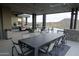 Outdoor patio with seating area, dining table, and infinity pool views at 41104 N 96Th St, Scottsdale, AZ 85262