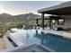 Modern infinity pool with spa and expansive mountain views at 41104 N 96Th St, Scottsdale, AZ 85262