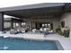 Stunning infinity pool with fire pit and patio seating at 41104 N 96Th St, Scottsdale, AZ 85262