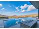 Infinity pool with fire pit and scenic mountain views at 41104 N 96Th St, Scottsdale, AZ 85262