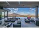 Expansive covered patio with infinity pool and breathtaking mountain views at 41104 N 96Th St, Scottsdale, AZ 85262