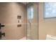 Spa-like shower with glass enclosure and neutral tile at 41104 N 96Th St, Scottsdale, AZ 85262