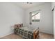 Cozy bedroom with wood bed frame and window at 4212 S 78Th Ln, Phoenix, AZ 85043