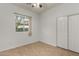 Bright bedroom with tile flooring, window, and double door closet at 4212 S 78Th Ln, Phoenix, AZ 85043