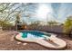 Relaxing kidney-shaped pool with diving board and patio area at 4212 S 78Th Ln, Phoenix, AZ 85043