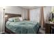 Bedroom with a double bed and wood headboard at 4240 N 67Th Ln, Phoenix, AZ 85033