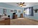 Bedroom with desk, chair, and ceiling fan at 43579 W Arizona Ave, Maricopa, AZ 85138