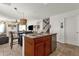 Kitchen with island, stainless steel appliances, and ample cabinet space at 43579 W Arizona Ave, Maricopa, AZ 85138