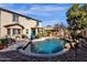 Inviting kidney-shaped pool with ample patio space for lounging at 43579 W Arizona Ave, Maricopa, AZ 85138