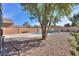 Landscaped backyard showcasing a refreshing pool and desert landscaping at 45091 W Cypress Ln, Maricopa, AZ 85139