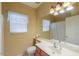 Bright bathroom featuring a large mirror and updated fixtures at 45091 W Cypress Ln, Maricopa, AZ 85139