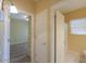 Clean bathroom with a shower/tub combo and updated vanity at 45091 W Cypress Ln, Maricopa, AZ 85139