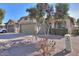 House exterior with a two-car garage, landscaping, and a driveway at 45091 W Cypress Ln, Maricopa, AZ 85139