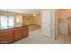 Kitchen with island, stainless steel appliances, and laundry at 45091 W Cypress Ln, Maricopa, AZ 85139