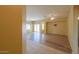 Bright and spacious living room with wood-look flooring at 45091 W Cypress Ln, Maricopa, AZ 85139