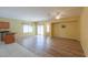 Open concept living area with wood-look floors and kitchen views at 45091 W Cypress Ln, Maricopa, AZ 85139