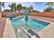 Sparkling, refreshing pool with two umbrellas and a spacious deck at 45091 W Cypress Ln, Maricopa, AZ 85139