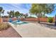 Inviting swimming pool with a spacious deck, offering ample relaxation space at 45091 W Cypress Ln, Maricopa, AZ 85139