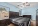 Bedroom with a ceiling fan and view of backyard at 4572 E Silverbell Rd, San Tan Valley, AZ 85143