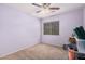 Simple bedroom with ceiling fan and window at 4572 E Silverbell Rd, San Tan Valley, AZ 85143