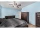 Bedroom with a ceiling fan and lots of closet space at 4572 E Silverbell Rd, San Tan Valley, AZ 85143