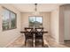 Dining area with a wood table and chairs, offering natural light at 4572 E Silverbell Rd, San Tan Valley, AZ 85143