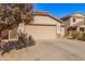 Exterior view of a house with a two-car garage and driveway at 4572 E Silverbell Rd, San Tan Valley, AZ 85143