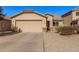 House exterior featuring a two-car garage and well-maintained landscaping at 4572 E Silverbell Rd, San Tan Valley, AZ 85143