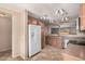 Kitchen with light wood cabinets, stainless steel appliances, and tile floor at 4572 E Silverbell Rd, San Tan Valley, AZ 85143