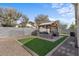 Artificial turf and pergola backyard at 45762 W Dirk St, Maricopa, AZ 85139