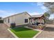 Backyard with artificial turf and pergola at 45762 W Dirk St, Maricopa, AZ 85139