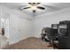 Bedroom with home office setup and ceiling fan at 45762 W Dirk St, Maricopa, AZ 85139