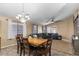 Spacious dining area with a large wooden table at 45762 W Dirk St, Maricopa, AZ 85139