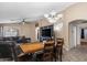 Bright dining area with wood table and seating for six at 45762 W Dirk St, Maricopa, AZ 85139