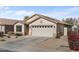 One-story house featuring a two-car garage and drought-tolerant landscaping at 45762 W Dirk St, Maricopa, AZ 85139