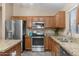 Eat-in kitchen with granite countertops and stainless steel appliances at 45762 W Dirk St, Maricopa, AZ 85139